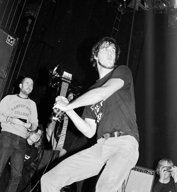 Krist Novoselic about to smash his bass